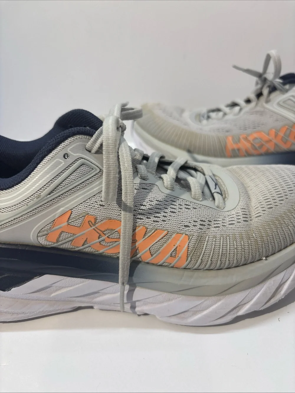 Hoka women’s size 7 gray/peach Bindi 7 style #110531 LRBI in fair condition.